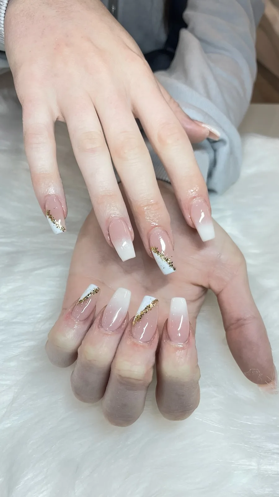 White-to-nude ombre coffin nails with gold leaf — Minack Beauty nail work